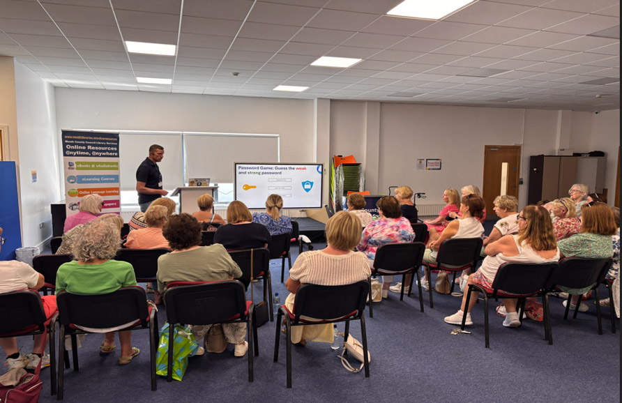 Man giving presentation to small crowd